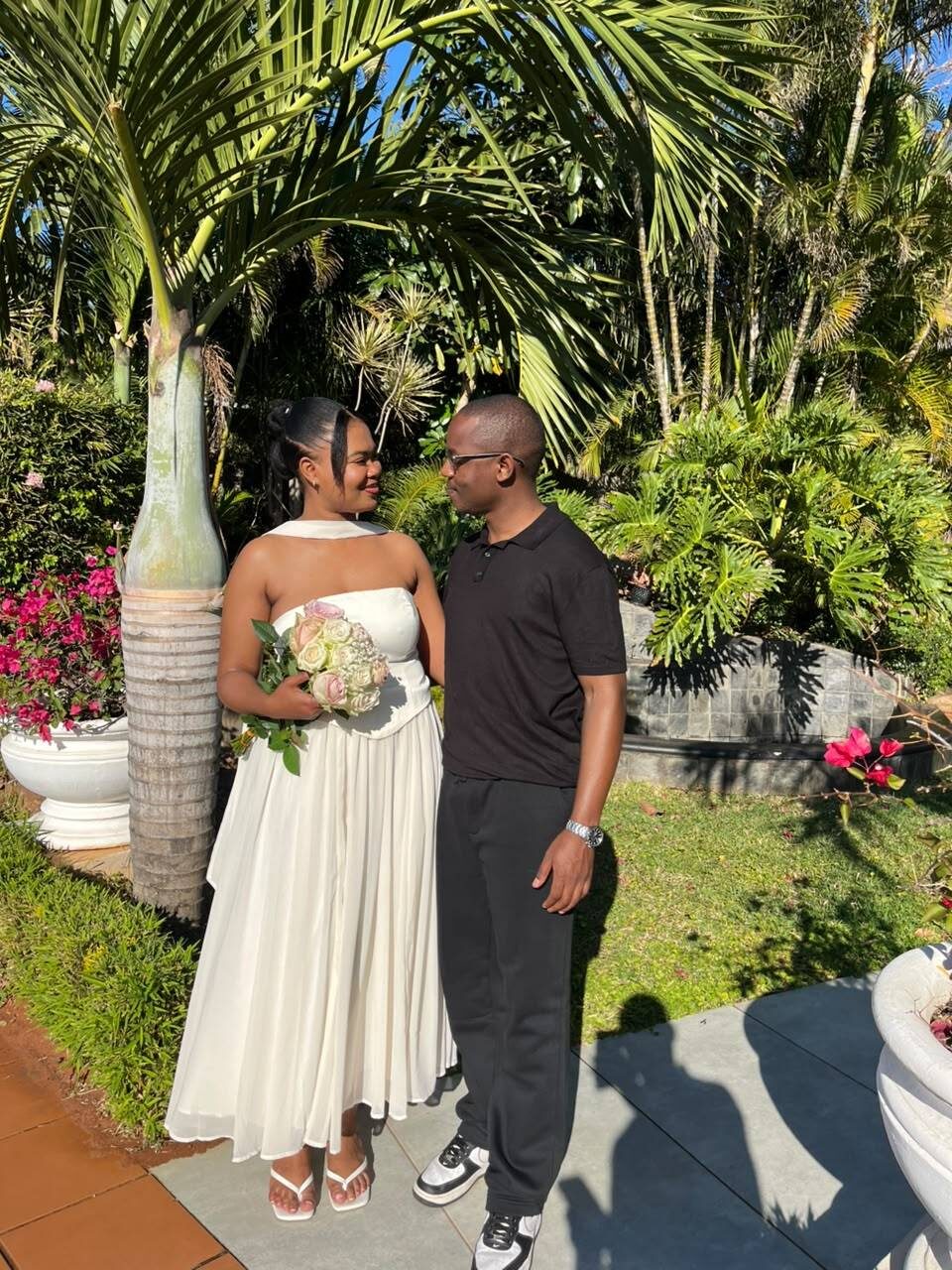 Chukwuma and Ellen together in a garden setting